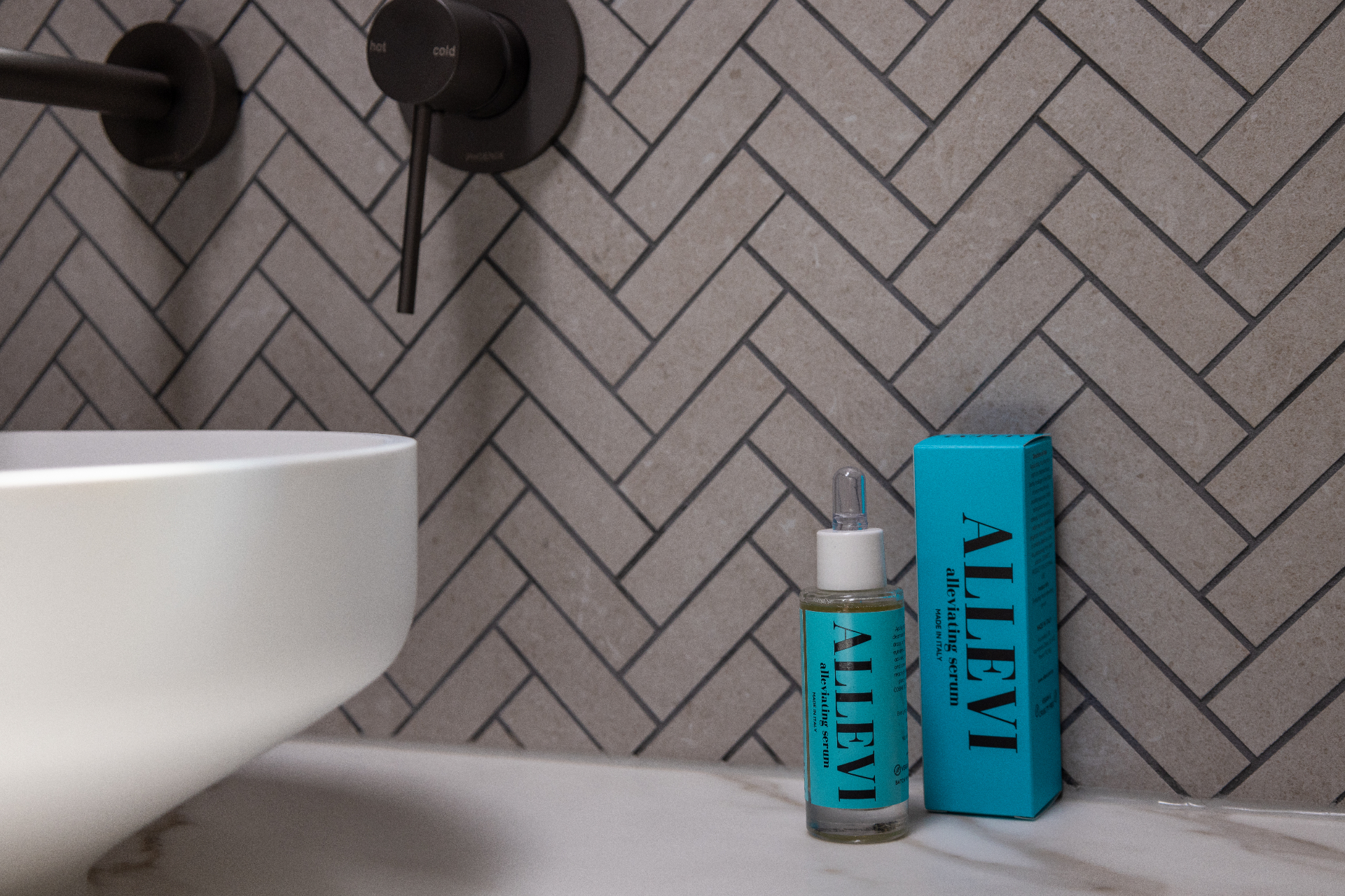 The Alleviating Serum photographed in a modern bathroom